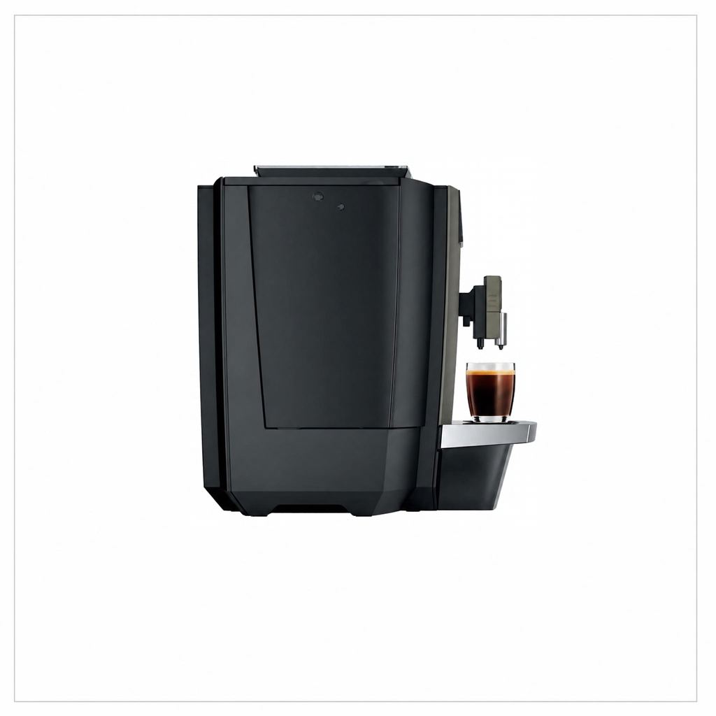 A sleek coffee machine with a small glass cup of espresso on its drip tray, shown against a plain white background.